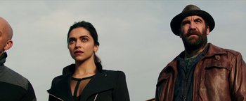 Movie still from “xXx: Return of Xander Cage” (2017), directed by D.J. Caruso – A woman standing next to a man wearing a black jacket; Close Up shot, Low angle