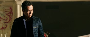 Movie still from “xXx: Return of Xander Cage” (2017), directed by D.J. Caruso – A man in a black shirt and a blue jacket; Close Up shot, Low angle