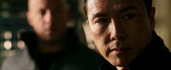 Movie still from “xXx: Return of Xander Cage” (2017), directed by D.J. Caruso – A man's face in front of another man; Close Up shot, Over the shoulder angle