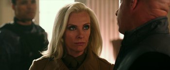 Movie still from “xXx: Return of Xander Cage” (2017), directed by D.J. Caruso – A woman with blonde hair wearing a brown jacket; Close Up shot, Over the shoulder angle
