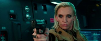 Movie still from “xXx: Return of Xander Cage” (2017), directed by D.J. Caruso – A woman is holding a gun in her hand; Close Up shot, Over the shoulder angle