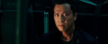 Movie still from “xXx: Return of Xander Cage” (2017), directed by D.J. Caruso – A person wearing a black shirt; Close Up shot, Over the shoulder angle