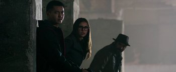 Movie still from “xXx: Return of Xander Cage” (2017), directed by D.J. Caruso – A group of people standing next to each other in a room; Medium shot, Over the shoulder angle