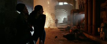 Movie still from “xXx: Return of Xander Cage” (2017), directed by D.J. Caruso – A woman standing in a room with a bunch of smoke coming out of the ground; Wide shot, Low angle