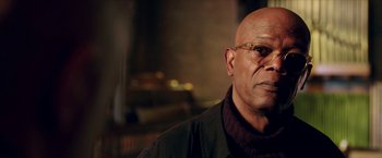 Movie still from “xXx: Return of Xander Cage” (2017), directed by D.J. Caruso – An older bald man wearing glasses and a black jacket; Close Up shot, Low angle