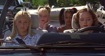Movie still from “10 Things I Hate About You” (1999), directed by Gil Junger – A group of women sitting in the back seat of a car; Medium shot, High angle