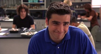 Movie still from “10 Things I Hate About You” (1999), directed by Gil Junger – A man in a blue shirt smiling for the camera; Close Up shot, Low angle