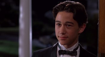 Movie still from “10 Things I Hate About You” (1999), directed by Gil Junger – A young man in a suit and bow tie; Close Up shot, Low angle