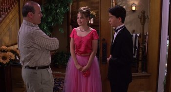 Movie still from “10 Things I Hate About You” (1999), directed by Gil Junger – A group of young people standing next to each other; Medium shot, High angle