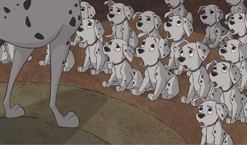 Movie still from “101 Dalmatians 2: Patch's London Adventure” (2002), directed by Brian Smith – A group of dalmatian puppies in front of an adult dalmatian; Wide shot, High angle