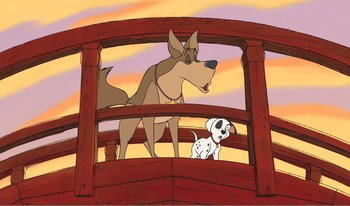 Movie still from “101 Dalmatians 2: Patch's London Adventure” (2002), directed by Brian Smith – A dog and a dalmatian are standing on a bridge; Wide shot, Low angle