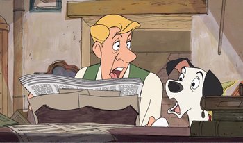 Movie still from “101 Dalmatians 2: Patch's London Adventure” (2002), directed by Brian Smith – A man and a dog looking at each other in front of a newspaper; Medium shot, Low angle