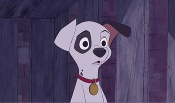 Movie still from “101 Dalmatians 2: Patch's London Adventure” (2002), directed by Brian Smith – A dog with a medal around its neck; Close Up shot, High angle
