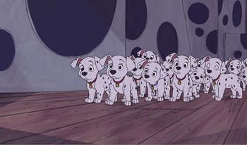 Movie still from “101 Dalmatians 2: Patch's London Adventure” (2002), directed by Brian Smith – A group of dalmatian dogs standing on a wooden floor; Wide shot, High angle