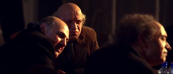 Movie still from “12” (2007), directed by Nikita Mikhalkov – A man and a woman looking at a computer screen; Medium shot, Over the shoulder angle