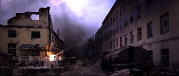 Movie still from “12” (2007), directed by Nikita Mikhalkov – A building that has been destroyed by a fire; Extreme Wide shot, High angle