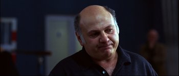 Movie still from “12” (2007), directed by Nikita Mikhalkov – An older man with a bald head is looking to his left; Close Up shot, Low angle