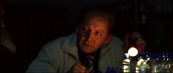 Movie still from “12” (2007), directed by Nikita Mikhalkov – A person wearing a tie; Close Up shot, Over the shoulder angle