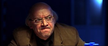 Movie still from “12” (2007), directed by Nikita Mikhalkov – An older man with glasses and a bald head; Close Up shot, Low angle