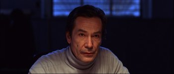 Movie still from “12” (2007), directed by Nikita Mikhalkov – A person wearing a white shirt; Close Up shot, Low angle