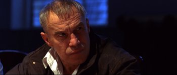 Movie still from “12” (2007), directed by Nikita Mikhalkov – An older man is looking at the camera; Close Up shot, Low angle