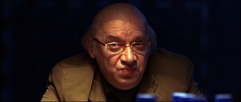 Movie still from “12” (2007), directed by Nikita Mikhalkov – An older man with glasses and a bald head; Close Up shot, Over the shoulder angle