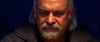 Movie still from “12” (2007), directed by Nikita Mikhalkov – An older man with a gray beard is looking sad; Close Up shot, Low angle