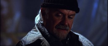 Movie still from “12” (2007), directed by Nikita Mikhalkov – An older man wearing a hat and a leather jacket; Close Up shot, Low angle