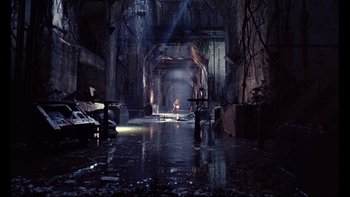 Movie still from “12 Monkeys” (1995), directed by Terry Gilliam – A person is standing in a flooded room; Extreme Wide shot, High angle