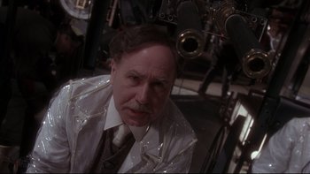 Movie still from “12 Monkeys” (1995), directed by Terry Gilliam – An older man in a white shirt and a tie; Close Up shot, Low angle