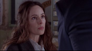 Movie still from “12 Monkeys” (1995), directed by Terry Gilliam – A person looking at something; Close Up shot, Over the shoulder angle