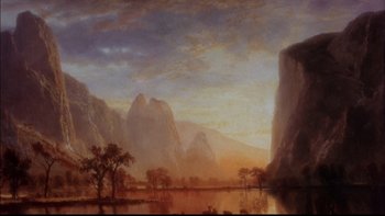 Movie still from “12 Monkeys” (1995), directed by Terry Gilliam – A painting of mountains and a body of water; Extreme Wide shot, High angle