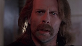 Movie still from “12 Monkeys” (1995), directed by Terry Gilliam – A person with long hair; Close Up shot, Low angle
