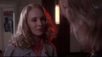 Movie still from “12 Monkeys” (1995), directed by Terry Gilliam – A woman with blonde curly hair looking at a man with blonde curly hair; Close Up shot, Over the shoulder angle