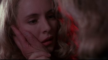 Movie still from “12 Monkeys” (1995), directed by Terry Gilliam – A person holding another person's hand; Close Up shot, Over the shoulder angle