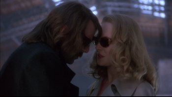 Movie still from “12 Monkeys” (1995), directed by Terry Gilliam – A man and a woman face to face; Close Up shot, Low angle