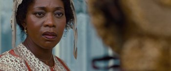 Movie still from “12 Years a Slave” (2013), directed by Steve McQueen – A woman's face in a mirror; Close Up shot, Over the shoulder angle