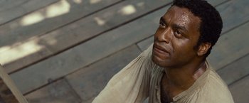 Movie still from “12 Years a Slave” (2013), directed by Steve McQueen – A person with his eyes closed; Close Up shot, High angle
