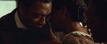 Movie still from “12 Years a Slave” (2013), directed by Steve McQueen – A man and a woman are looking at one another; Close Up shot, Over the shoulder angle