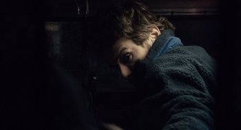 Movie still from “127 Hours” (2010), directed by Danny Boyle – A man with a dark jacket on looking at the camera; Close Up shot, Over the shoulder angle