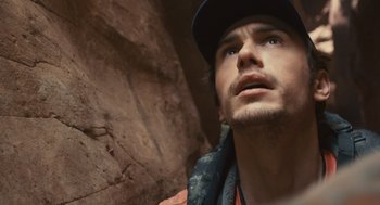 Movie still from “127 Hours” (2010), directed by Danny Boyle – A person wearing a hat; Close Up shot, Low angle