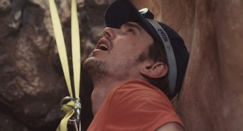 Movie still from “127 Hours” (2010), directed by Danny Boyle – A person on a rope; Close Up shot, Low angle