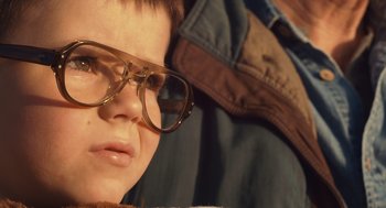 Movie still from “127 Hours” (2010), directed by Danny Boyle – A person wearing glasses; Close Up shot, Over the shoulder angle