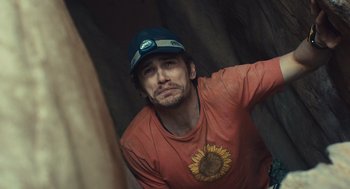 Movie still from “127 Hours” (2010), directed by Danny Boyle – A person wearing a hat; Close Up shot, Low angle