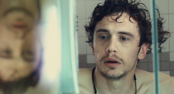 Movie still from “127 Hours” (2010), directed by Danny Boyle – A person in a mirror; Close Up shot, Over the shoulder angle