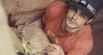Movie still from “127 Hours” (2010), directed by Danny Boyle – A person holding a rock; Close Up shot, Overhead angle