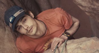 Movie still from “127 Hours” (2010), directed by Danny Boyle – A person with a watch; Close Up shot, Overhead angle
