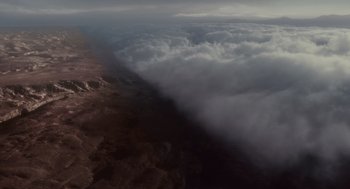 Movie still from “127 Hours” (2010), directed by Danny Boyle – A view of the sky from a plane; Extreme Wide shot, Overhead angle