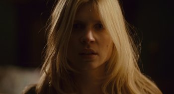 Movie still from “127 Hours” (2010), directed by Danny Boyle – A woman with long blonde hair stares into the camera; Close Up shot, Low angle