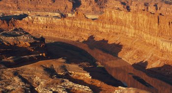 Movie still from “127 Hours” (2010), directed by Danny Boyle – A view of a canyon from a hill; Extreme Wide shot, High angle